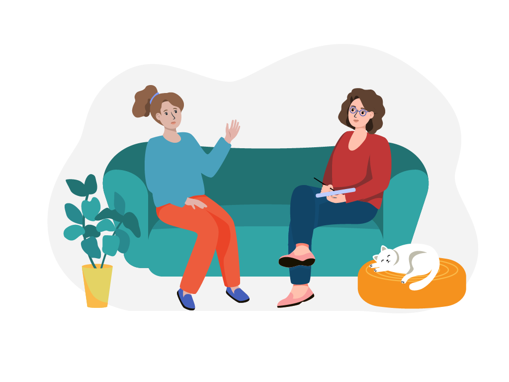 Zwei Frauen sitzten auf einem Sofa und unterhalten sich.